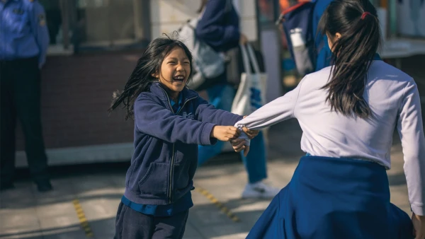 female students playing outside at international school of qingdao elementary