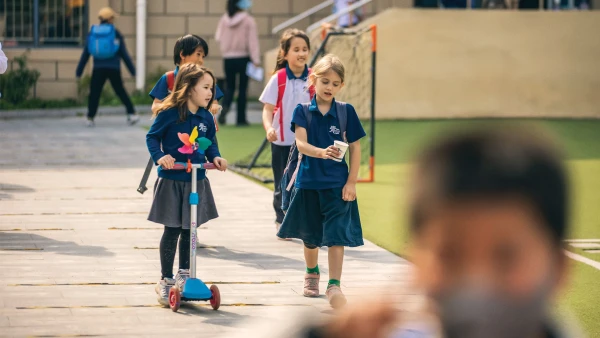 young students walking outside international school of qingdao early childhood learning