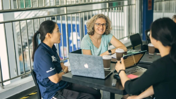 teachers on a coffee meeting inside international school of qingdao high school learning about their students