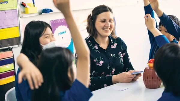 teacher answering student questions at international school of qingdao