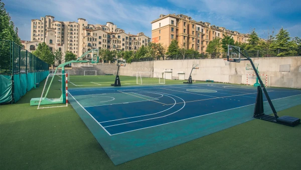 international school of qingdao facilities include basketball courts and soccer fields